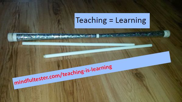 Devilstick and handsticks. Showing texts “Teaching = Learning” and “mindfultester.com/teaching-is-learning”!