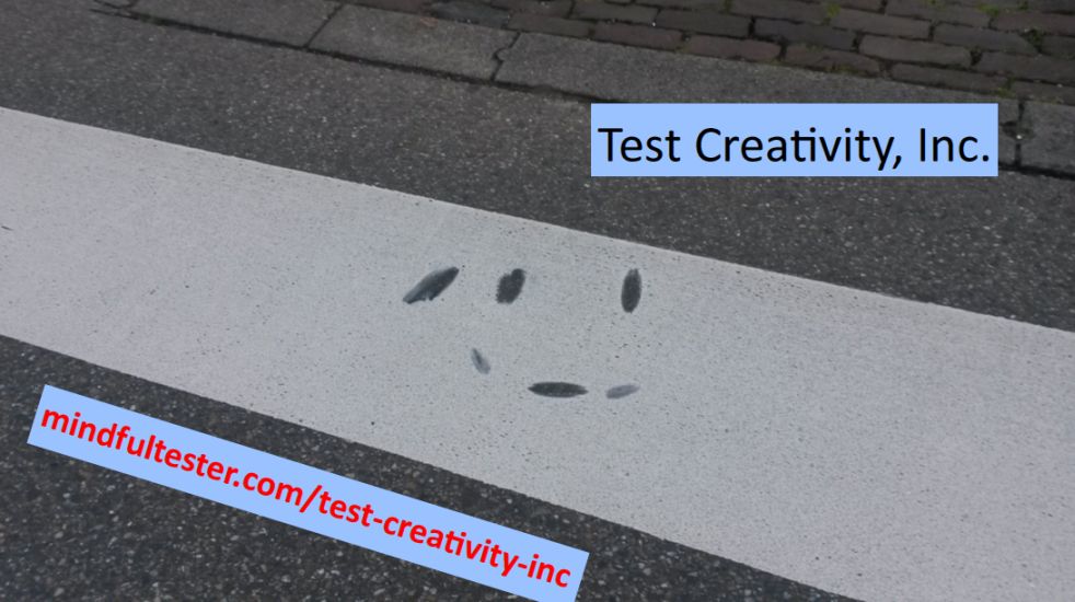 Paint vaguely resembling a smiley on pedestrian crossing. Showing texts “Test Creativity, Inc.” and “mindfultester.com/test-creativity-inc”!