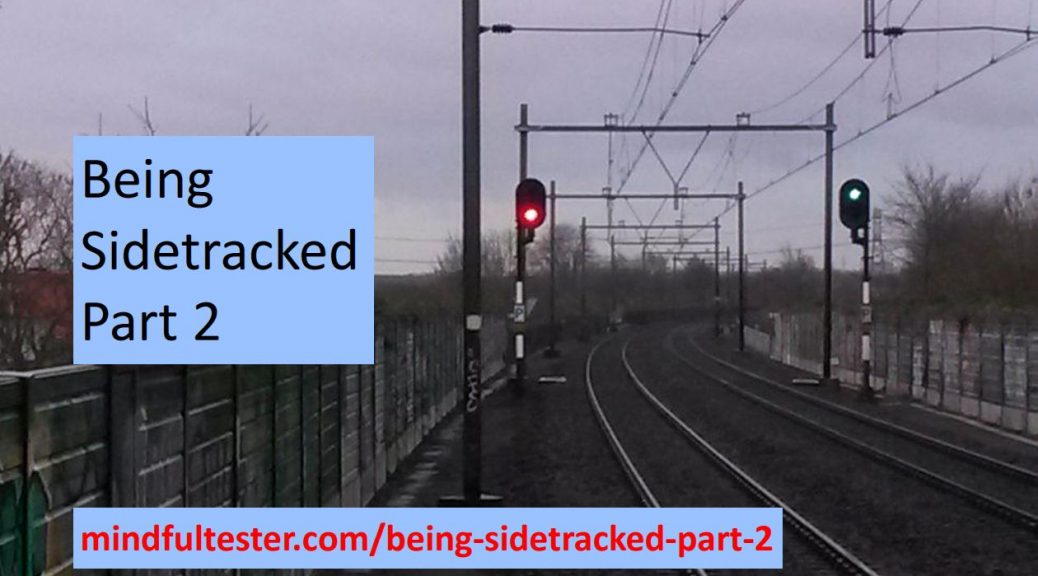 Railway with a red and green light in the early grey morning light. Showing texts “Being Sidetracked – Part 2” and “mindfultester.com/being-sidetracked-part-2”!