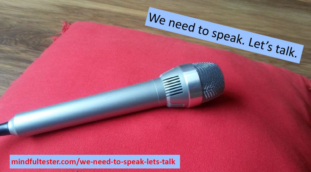 Microphone on a red cushion. mindfultester.com/we-need-to-speak-lets-talk"!